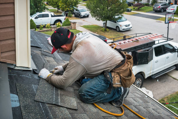 Professional Roofing technician working in West Roxbury, MA